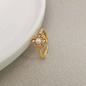 Fashionable temperament pearl four-leaf flower ring