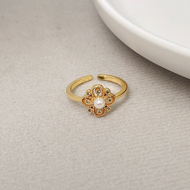 Fashionable temperament pearl four-leaf flower ring